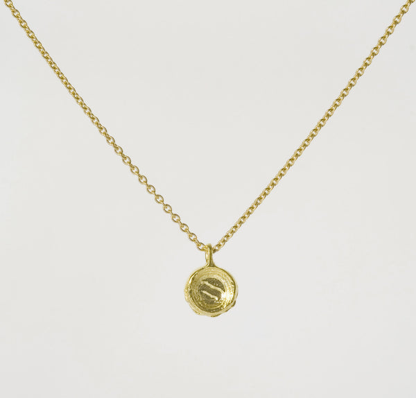 Diamond and gold pendant back view